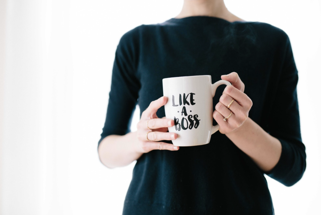 Boss holding a coffee cup