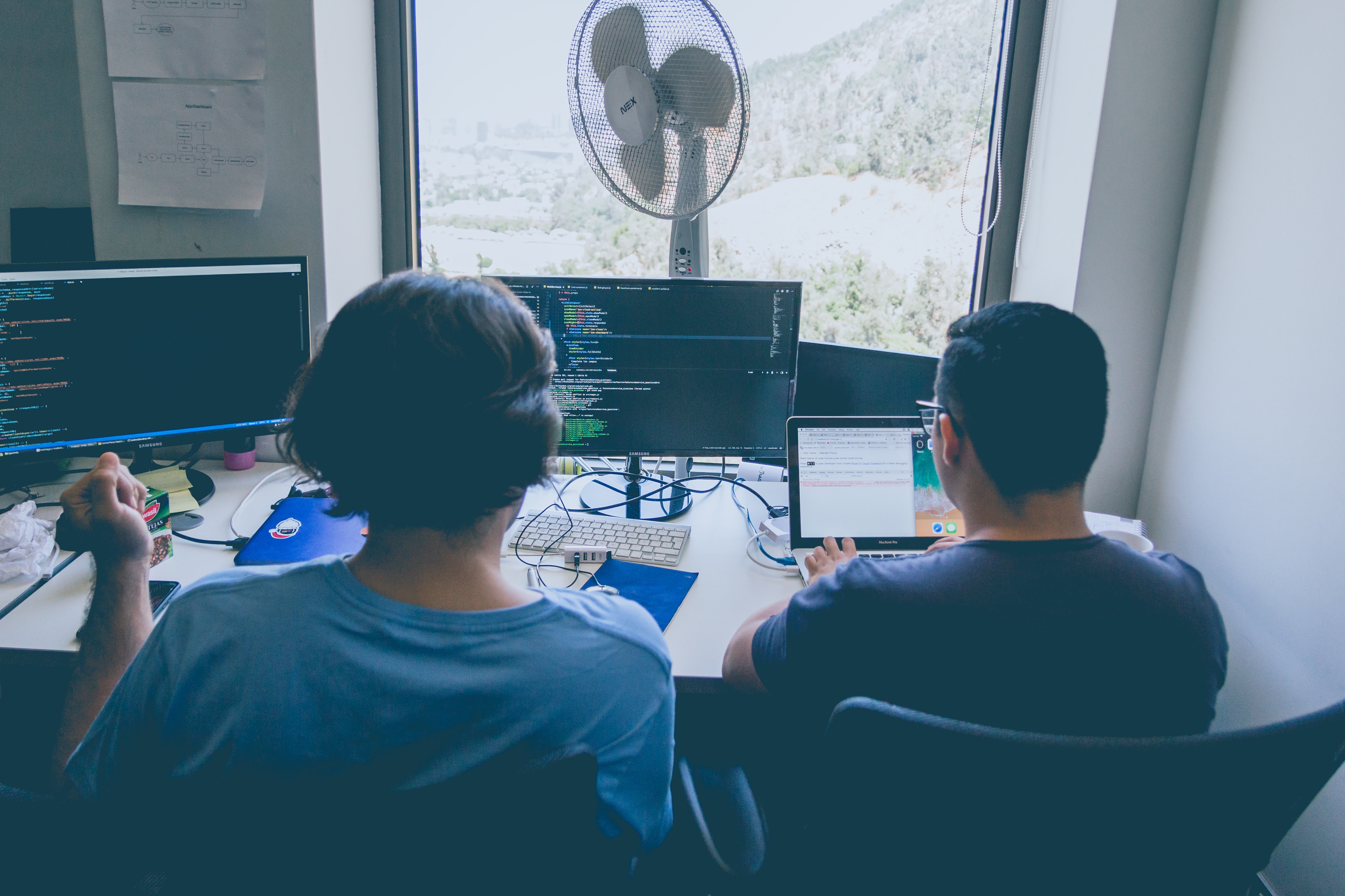 Two people reviewing code