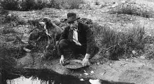 Old time miner panning for gold